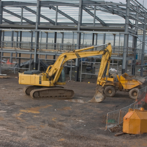 Digger on a building site - Genesis Insurance Services